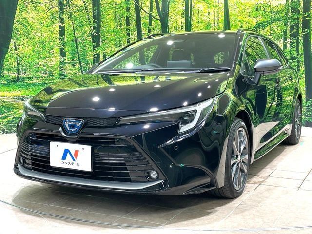 2023 Toyota Corolla Touring HYBRID WXB - photo 1 2023 Toyota Corolla Touring HYBRID WXB Van for sale, Japanese used car export - photo 1 of 24 | GULJI TRADERS