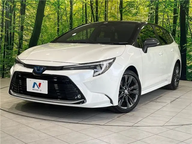 2024 Toyota Corolla Touring Hybrid Double By - photo 1 2024 Toyota Corolla Touring Hybrid Double By Pearl Van for sale, Japanese used car export - photo 1 of 30 | GULJI TRADERS