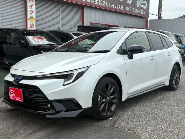 2024 Toyota Corolla Touring Active sports - photo 1 2024 Toyota Corolla Touring Active sports Pearl Van for sale, Japanese used car export - photo 1 of 23 | GULJI TRADERS