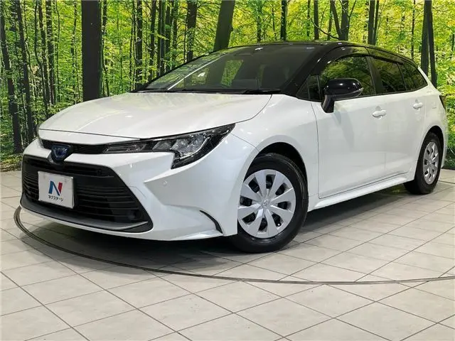 2024 Toyota Corolla Touring Hybrid G - photo 1 2024 Toyota Corolla Touring Hybrid G Pearl Van for sale, Japanese used car export - photo 1 of 30 | GULJI TRADERS