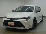 2024 Toyota Corolla Touring 1.8 Hybrid WxB E-Four 4WD Pearl Van for sale, Japanese used car export - photo 1 of 32 | GULJI TRADERS