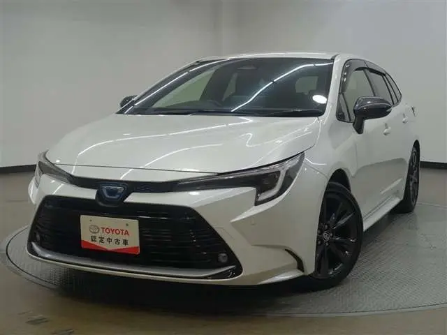 2024 Toyota Corolla Touring 1.8 Hybrid WxB E-Four 4WD Pearl Van for sale, Japanese used car export | GULJI TRADERS