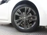 2024 Toyota Corolla Touring 1.8 Hybrid WxB E-Four 4WD Pearl Van for sale, Japanese used car export - photo 26 of 32 | GULJI TRADERS