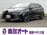 2024 Toyota Corolla Touring 1.8 Hybrid WxB E-Four 4WD Black Van for sale, Japanese used car export - photo 1 of 37 | GULJI TRADERS