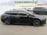 2024 Toyota Corolla Touring 1.8 Hybrid WxB E-Four 4WD Black Van for sale, Japanese used car export - photo 35 of 37 | GULJI TRADERS