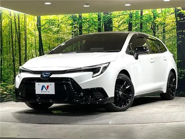 2024 Toyota Corolla Touring Active sports - photo 1 2024 Toyota Corolla Touring Active sports Pearl Van for sale, Japanese used car export - photo 1 of 30 | GULJI TRADERS