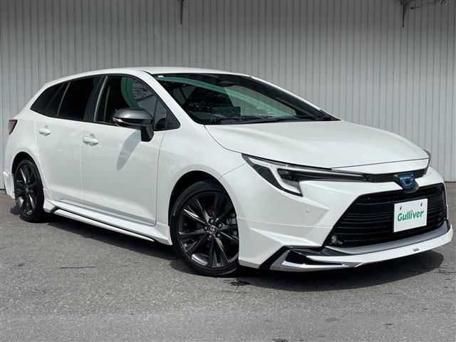 2024 Toyota Corolla Touring Hybrid 4WD Van for sale, Japanese used car export - photo 1 of 24 | GULJI TRADERS
