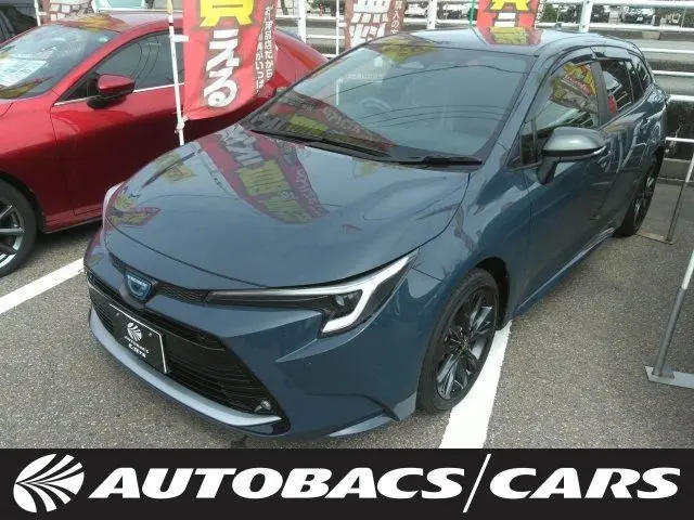 2024 Toyota Corolla Touring W×B (Hybrid Vehicle) 4WD - photo 1 2024 Toyota Corolla Touring W×B (Hybrid Vehicle) 4WD Gray Van for sale, Japanese used car export - photo 1 of 3 | GULJI TRADERS