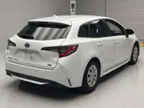 2024 Toyota Corolla Touring Hybrid G Pearl Van for sale, Japanese used car export - photo 2 of 12 | GULJI TRADERS