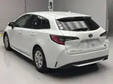 2024 Toyota Corolla Touring Hybrid G Pearl Van for sale, Japanese used car export - photo 4 of 12 | GULJI TRADERS