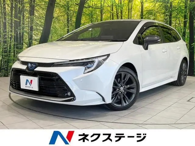 2024 Toyota Corolla Touring Hybrid Double By - photo 1 2024 Toyota Corolla Touring Hybrid Double By White Van for sale, Japanese used car export - photo 1 of 9 | GULJI TRADERS