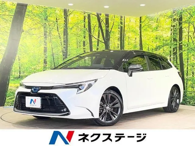 2024 Toyota Corolla Touring Hybrid Double By - photo 1 2024 Toyota Corolla Touring Hybrid Double By Black Van for sale, Japanese used car export - photo 1 of 9 | GULJI TRADERS