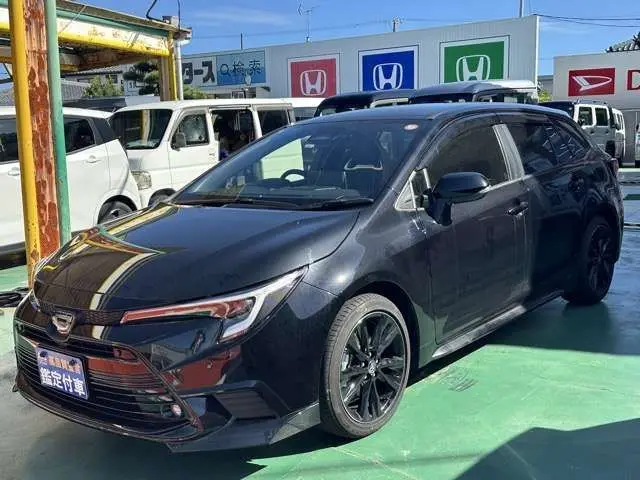2025 Toyota Corolla Touring 1.8 Hybrid Active Sport, Genuine Navigation System, LED Headlights Black Van for sale, Japanese used car export | GULJI TRADERS