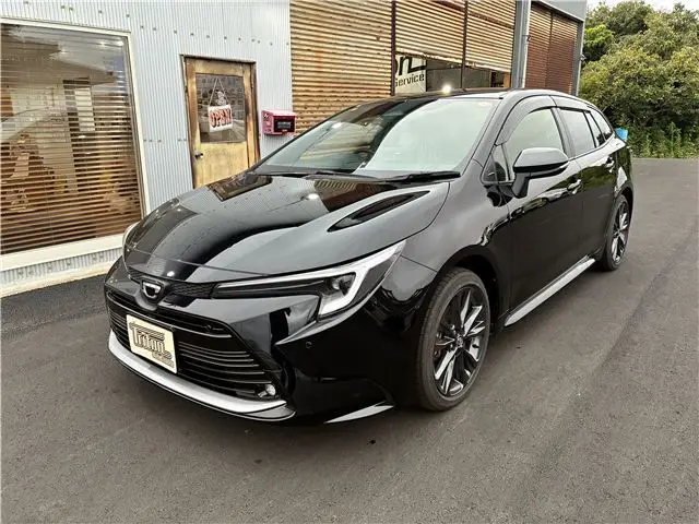 2025 Toyota Corolla Touring Hybrid Double WxB 4WD Black Van for sale, Japanese used car export | GULJI TRADERS