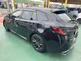 2025 Toyota Corolla Touring 1.8 Hybrid WxB Genuine Display Audio Navigation Function Black Van for sale, Japanese used car export - photo 2 of 25 | GULJI TRADERS