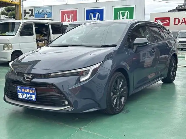 2025 Toyota Corolla Touring 1.8 Hybrid WxB Genuine Display Audio Navigation Function Gray Van for sale, Japanese used car export | GULJI TRADERS