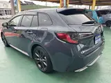 2025 Toyota Corolla Touring 1.8 Hybrid WxB Genuine Display Audio Navigation Function Gray Van for sale, Japanese used car export - photo 2 of 26 | GULJI TRADERS
