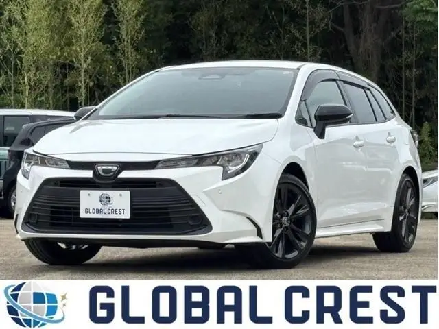 2025 Toyota Corolla Touring 1.8HV x pure 17AW - photo 1 2025 Toyota Corolla Touring 1.8HV x pure 17AW White Van for sale, Japanese used car export - photo 1 of 30 | GULJI TRADERS