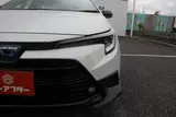 2025 Toyota Corolla Touring 1.8 HV ACTIVE SPORT White Van for sale, Japanese used car export - photo 26 of 30 | GULJI TRADERS