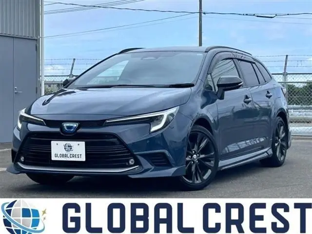 2025 Toyota Corolla Touring 1.8 Hybrid WxB - photo 1 2025 Toyota Corolla Touring 1.8 Hybrid WxB Gray Van for sale, Japanese used car export - photo 1 of 28 | GULJI TRADERS