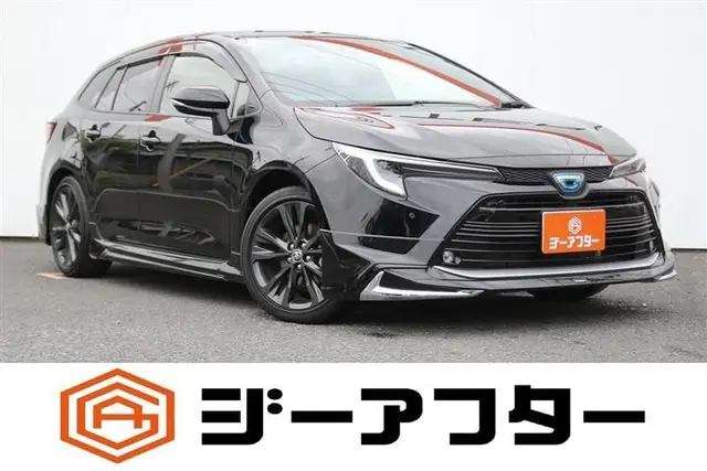 2025 Toyota Corolla Touring 1.8 HYBRID WxB Black Van for sale, Japanese used car export | GULJI TRADERS