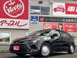 2025 Toyota Corolla Touring 1.8 Hybrid X E-Four 4WD Black Van for sale, Japanese used car export - photo 1 of 20 | GULJI TRADERS
