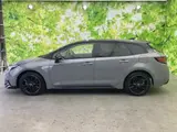 2025 Toyota Corolla Touring 4WD Hybrid Active Black Van for sale, Japanese used car export - photo 2 of 9 | GULJI TRADERS