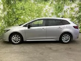 2025 Toyota Corolla Touring Hybrid G Silver Van for sale, Japanese used car export - photo 2 of 9 | GULJI TRADERS
