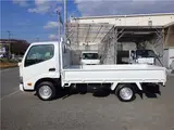 2019 Toyota Dyna Truck Flatbed truck, 1.25t load capacity, 10-foot length, standard, low-floor, manual transmission, gasoline engine. White Color changed Truck for sale, Japanese used car export - photo 3 of 46 | GULJI TRADERS