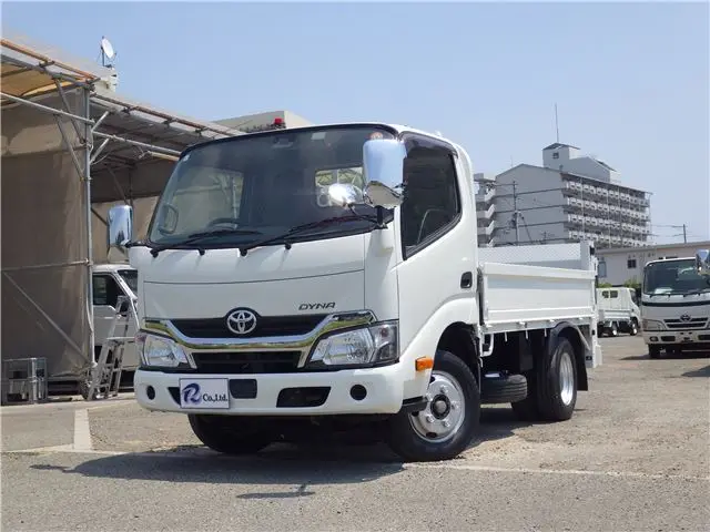 2019 Toyota Dyna Truck Flatbed, vertical power loading, 2-ton capacity, low-floor, manual transmission, diesel engine. White Truck for sale, Japanese used car export - photo 1 of 51 | GULJI TRADERS