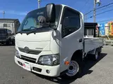 2019 Toyota Dyna Truck 1.5t capacity, flatbed truck, standard driver's license required, steel bed floor, 5-speed manual transmission. White Truck for sale, Japanese used car export - photo 1 of 45 | GULJI TRADERS