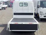 2021 Toyota Dyna Truck Flatbed, standard, low-floor, suitable for regular driver's licenses, with wooden floorboards, navigation system, TV, keyless entry, 1.5t capacity. White Truck for sale, Japanese used car export - photo 6 of 51 | GULJI TRADERS