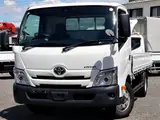2021 Toyota Dyna Truck Flatbed, 2-ton load capacity, wide and long, low-floor design. White Truck for sale, Japanese used car export - photo 1 of 6 | GULJI TRADERS