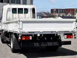 2021 Toyota Dyna Truck Flatbed, 2-ton load capacity, wide and long, low-floor design. White Truck for sale, Japanese used car export - photo 2 of 6 | GULJI TRADERS