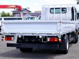 2021 Toyota Dyna Truck Flatbed, 2-ton load capacity, wide and long, low-floor design. White Truck for sale, Japanese used car export - photo 4 of 6 | GULJI TRADERS