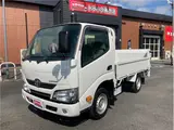 2021 Toyota Dyna Truck 1-ton capacity, flatbed, vertical gate, low-floor, MT5 White Painted Truck for sale, Japanese used car export - photo 1 of 76 | GULJI TRADERS