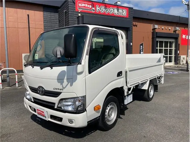 2021 Toyota Dyna Truck 1-ton capacity, flatbed, vertical gate, low-floor, MT5 White Painted Truck for sale, Japanese used car export - photo 1 of 76 | GULJI TRADERS
