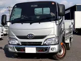 2021 Toyota Dyna Truck Vertical power gate, 1500kg load capacity, flatbed body, compliant with new standard driver's license, G package. Silver Truck for sale, Japanese used car export - photo 1 of 6 | GULJI TRADERS