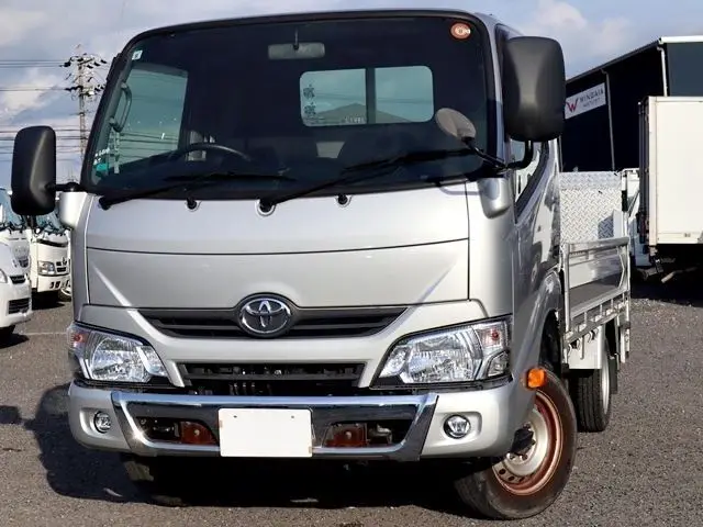 2021 Toyota Dyna Truck Vertical power gate, 1500kg load capacity, flatbed body, compliant with new standard driver's license, G package. Silver Truck for sale, Japanese used car export - photo 1 of 6 | GULJI TRADERS