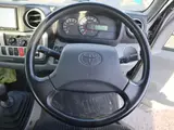 2021 Toyota Dyna Truck Vertical power gate, 1500kg load capacity, flatbed body, compliant with new standard driver's license, G package. Silver Truck for sale, Japanese used car export - photo 3 of 6 | GULJI TRADERS