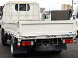 2021 Toyota Dyna Truck Flatbed truck, 2-ton load capacity, standard 10-foot body, Justlow, gross vehicle weight less than 5 tons. White Truck for sale, Japanese used car export - photo 4 of 6 | GULJI TRADERS