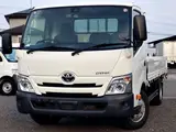 2021 Toyota Dyna Truck Flatbed, 2-ton load capacity, wide long, low-floor, gross vehicle weight less than 5 tons White Truck for sale, Japanese used car export - photo 1 of 6 | GULJI TRADERS