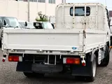 2021 Toyota Dyna Truck Flatbed truck, 2-ton load capacity, standard 10-foot body, Justlow, gross vehicle weight less than 5 tons. White Truck for sale, Japanese used car export - photo 4 of 6 | GULJI TRADERS
