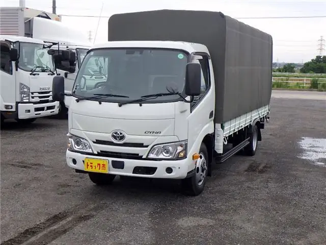 2022 Toyota Dyna Truck Flatbed truck with canvas cover, standard long, just low, cargo bed floorboard, collision mitigation, 2-ton capacity. - photo 1 2022 Toyota Dyna Truck Flatbed truck with canvas cover, standard long, just low, cargo bed floorboard, collision mitigation, 2-ton capacity. White Truck for sale, Japanese used car export - photo 1 of 51 | GULJI TRADERS