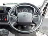 2022 Toyota Dyna Truck 4WD Standard 10-foot Flatbed 2-ton Low-floor Collision Mitigation Brake 5-speed Manual Transmission White Truck for sale, Japanese used car export - photo 11 of 51 | GULJI TRADERS