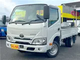 2022 Toyota Dyna Truck 1.5-ton low-floor 10-foot flatbed truck with reduced braking system, keyless entry, and automatic transmission. White Truck for sale, Japanese used car export - photo 1 of 45 | GULJI TRADERS