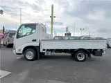 2022 Toyota Dyna Truck 1.5-ton low-floor 10-foot flatbed truck with reduced braking system, keyless entry, and automatic transmission. White Truck for sale, Japanese used car export - photo 3 of 45 | GULJI TRADERS