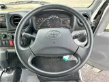 2022 Toyota Dyna Truck 1.5-ton low-floor 10-foot flatbed truck with reduced braking system, keyless entry, and automatic transmission. White Truck for sale, Japanese used car export - photo 16 of 45 | GULJI TRADERS