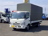 2022 Toyota Dyna Truck Flatbed truck with canvas cover, wide extra-long, 2-ton capacity, 5m cargo bed, collision mitigation system, 6-speed manual transmission. White Truck for sale, Japanese used car export - photo 1 of 51 | GULJI TRADERS