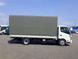 2022 Toyota Dyna Truck Flatbed truck with canvas cover, wide extra-long, 2-ton capacity, 5m cargo bed, collision mitigation system, 6-speed manual transmission. White Truck for sale, Japanese used car export - photo 4 of 51 | GULJI TRADERS